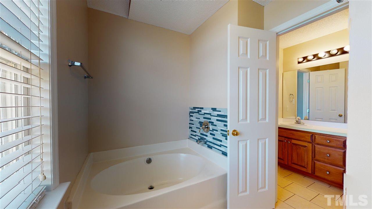 1405 Harvey Johnson Road Raleigh, NC 27603 - Photo 15 of 30 Master Bath with garden tub & separate shower