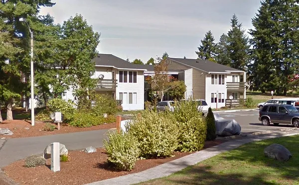 a view of a house with a cars park