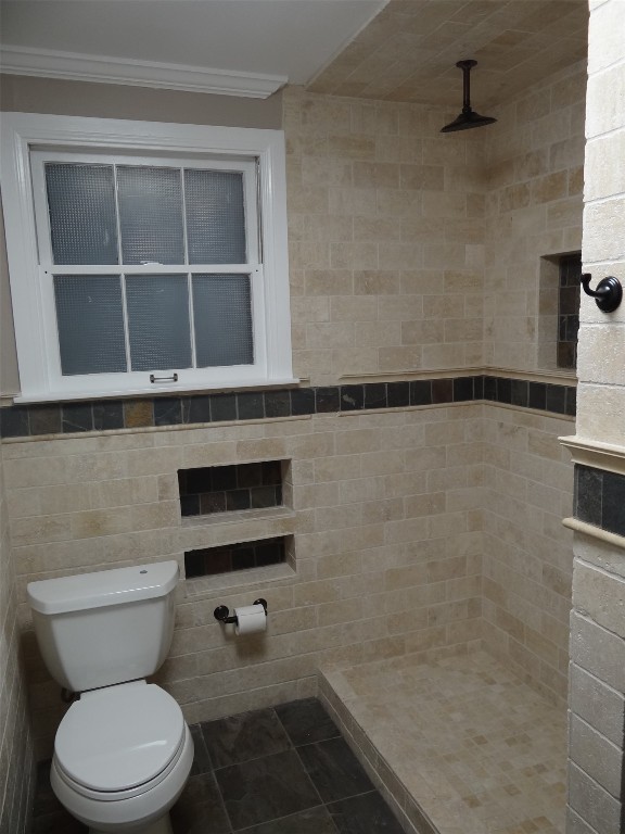 912 East 32nd Street, Unit 103 Austin, TX 78705 - Photo 18 of 27 a bathroom with a toilet and a shower