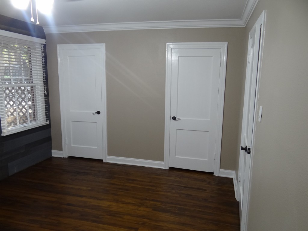912 East 32nd Street, Unit 103 Austin, TX 78705 - Photo 20 of 27 a view of empty room with wooden floor and fan