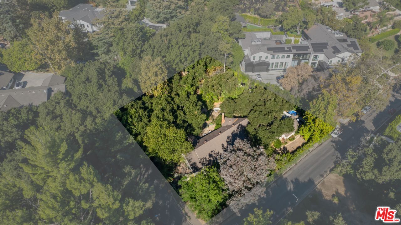 16055 Woodvale Road Encino, CA 91436 - Photo 2 of 5 a view of a city with a building