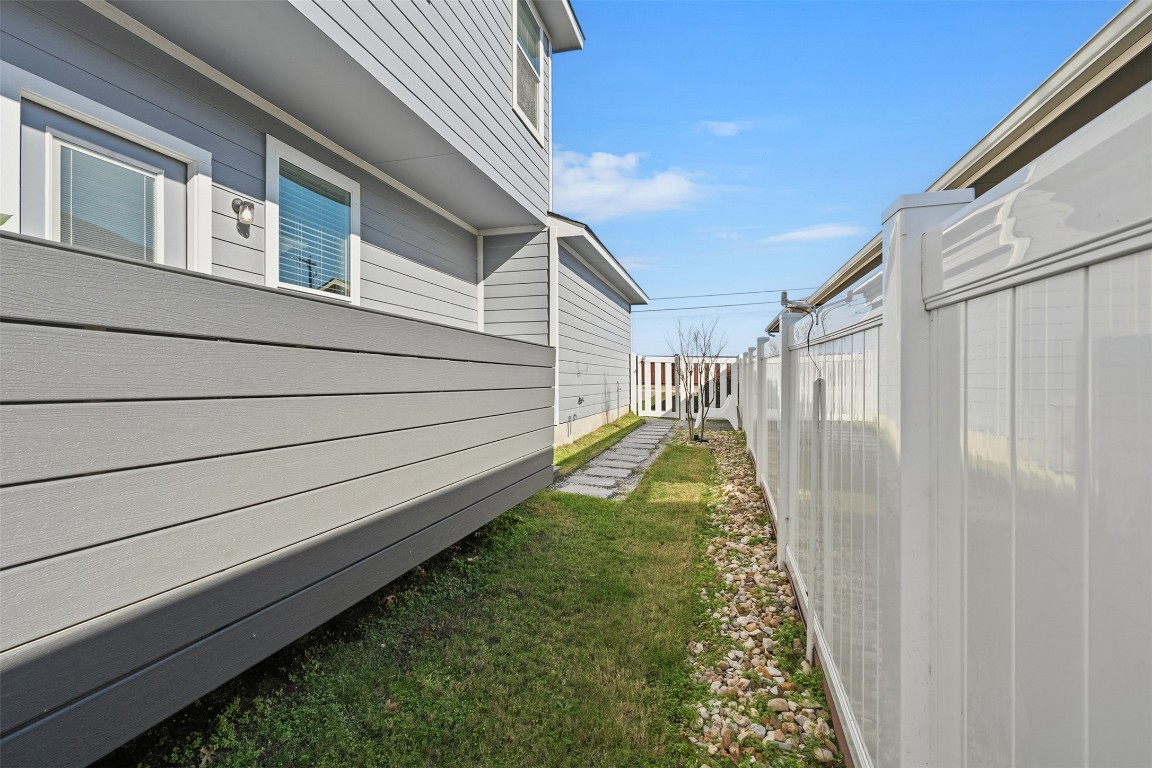 404 Cane River Road Pflugerville, TX 78660 - Photo 19 of 24 a view of a backyard with white house