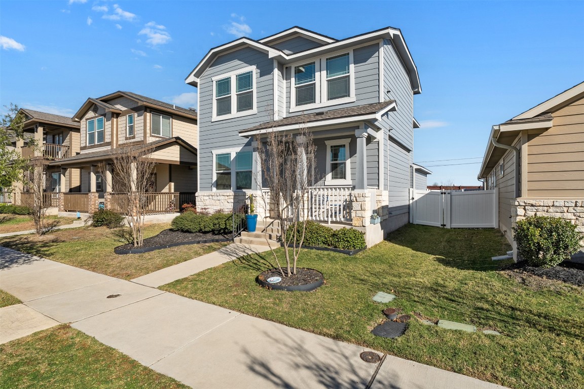 404 Cane River Road Pflugerville, TX 78660 - Photo 3 of 24 a front view of a house with garden