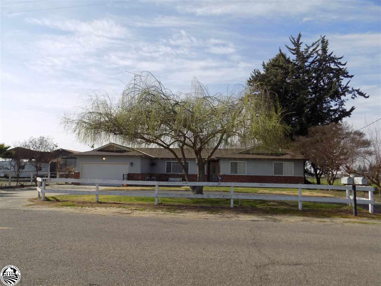 4407 Mountain View Road Hughson, CA 95326 - Photo 1 of 11 a view of swimming pool is middle in the middle of a garden