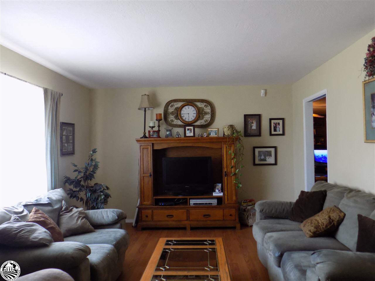 4407 Mountain View Road Hughson, CA 95326 - Photo 2 of 11 a living room with furniture a flat screen tv and a fireplace