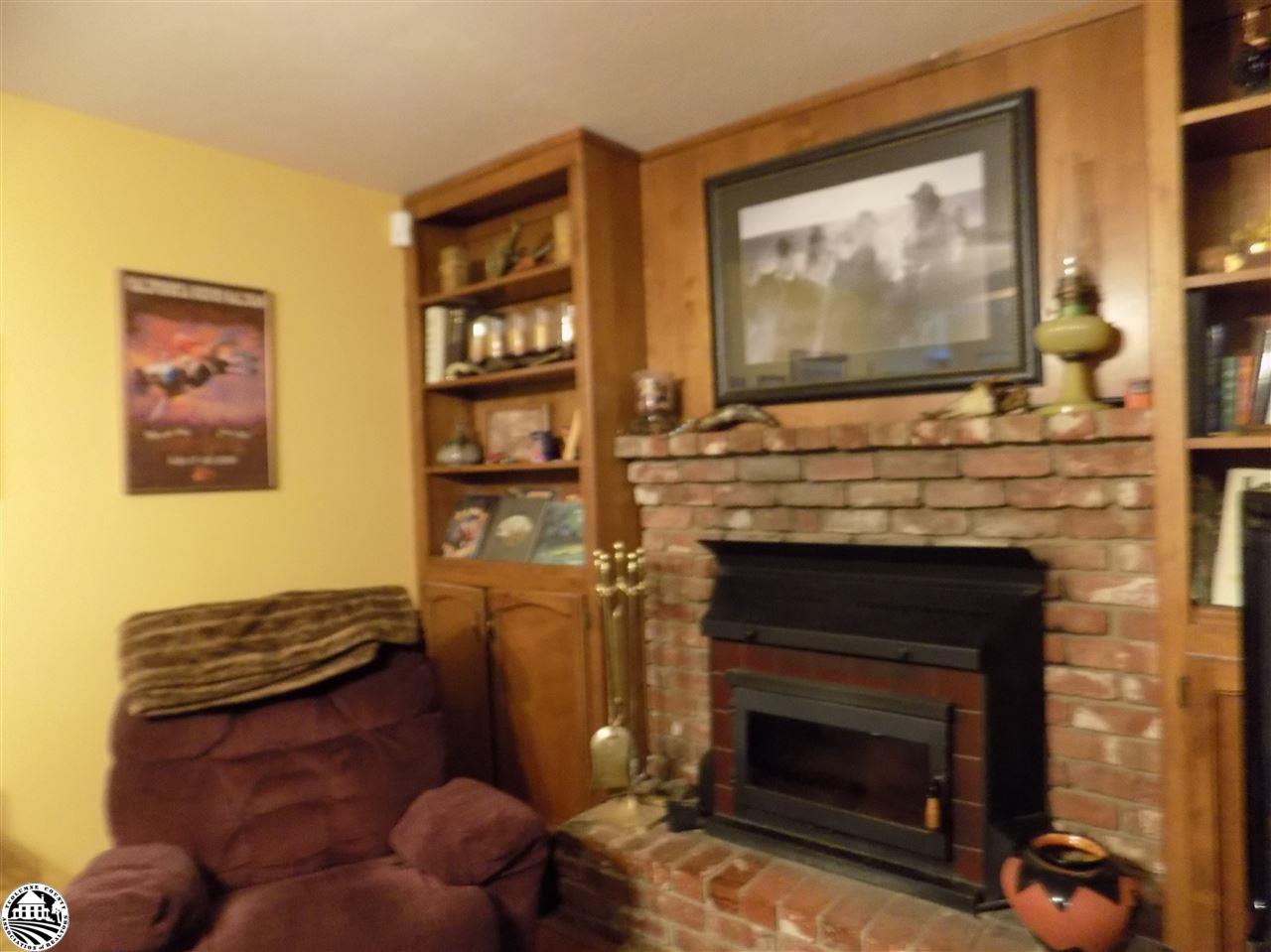 4407 Mountain View Road Hughson, CA 95326 - Photo 3 of 11 a living room with furniture and a fireplace