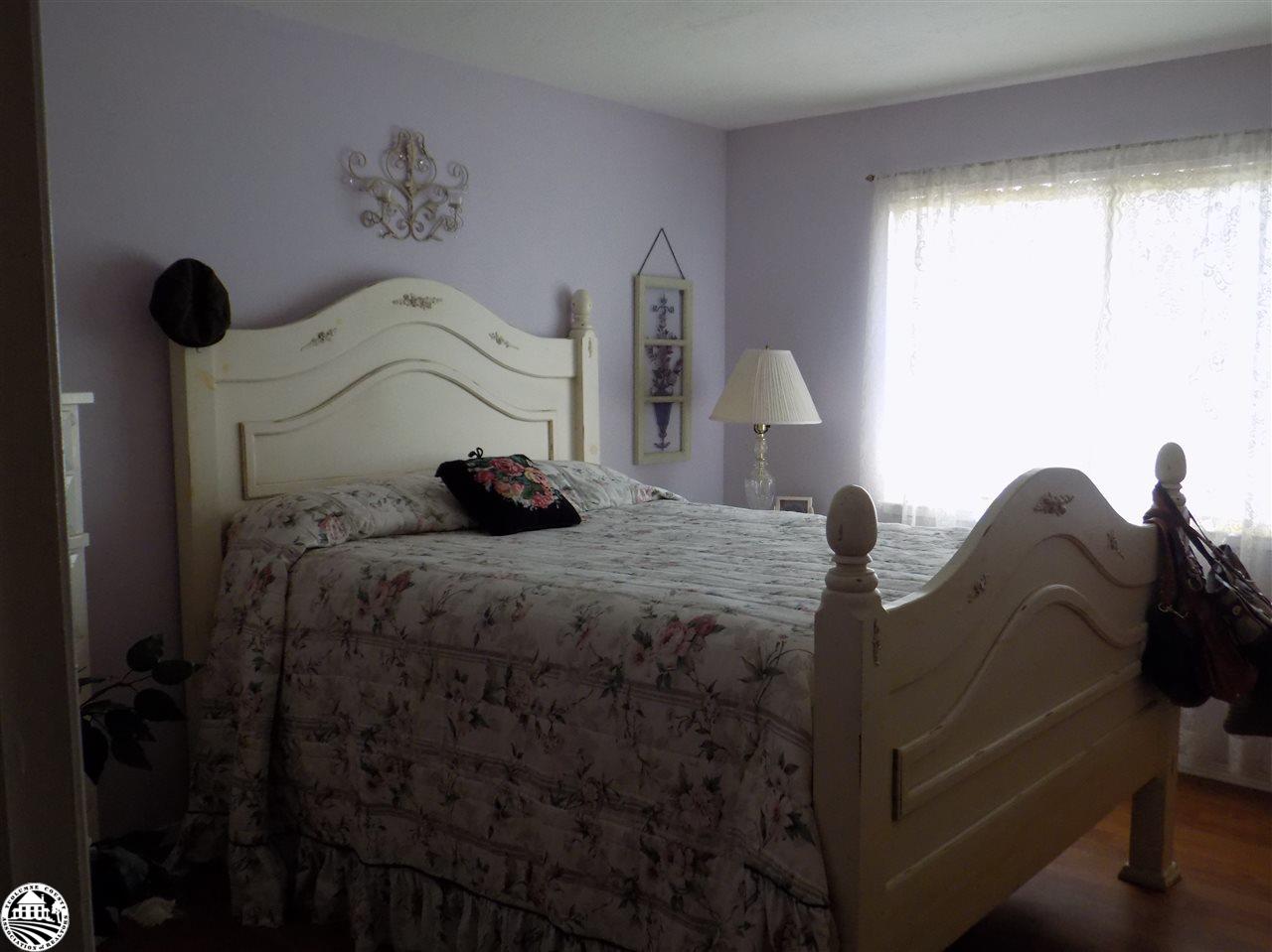 4407 Mountain View Road Hughson, CA 95326 - Photo 7 of 11 a bedroom with a bed and a window