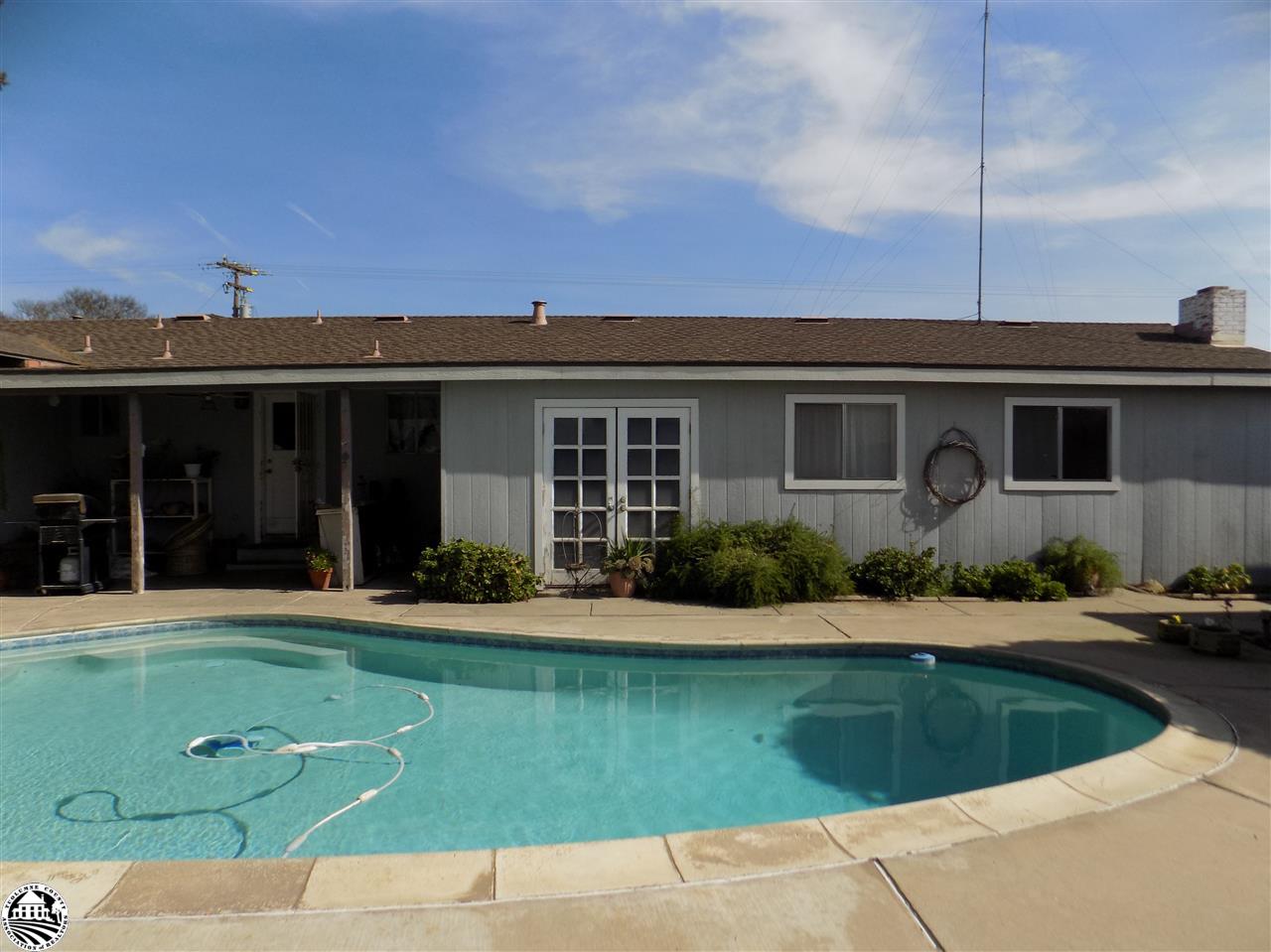 4407 Mountain View Road Hughson, CA 95326 - Photo 8 of 11 a front view of a house with a yard