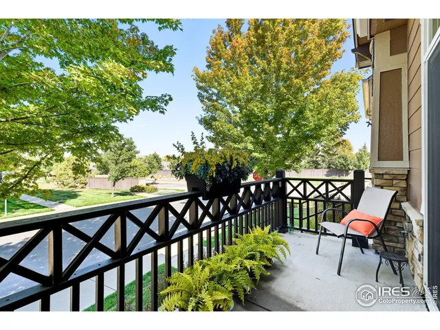 a view of a chairs and table in the balcony