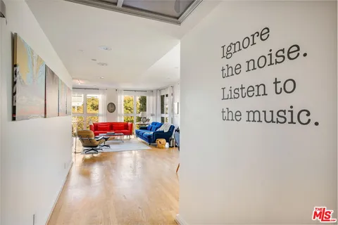 a view of a room with furniture and a rug