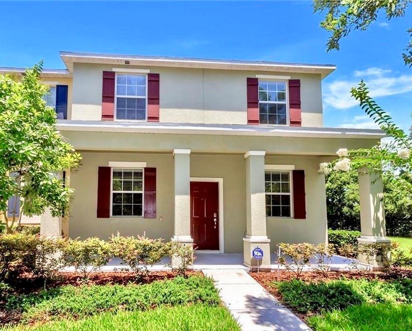 1391 Vasey Road Apopka, FL 32703 - Photo 1 of 1 a front view of a house with a yard