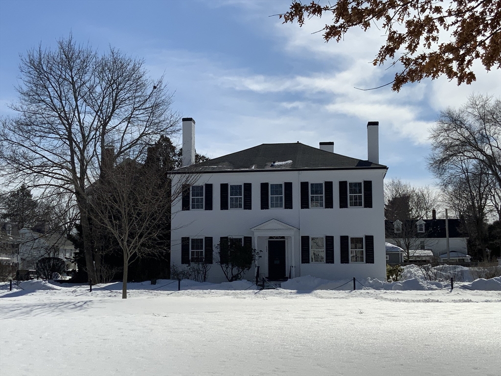 660 High Street Dedham, MA 02026 - Photo 1 of 25 a front view of a house with a yard