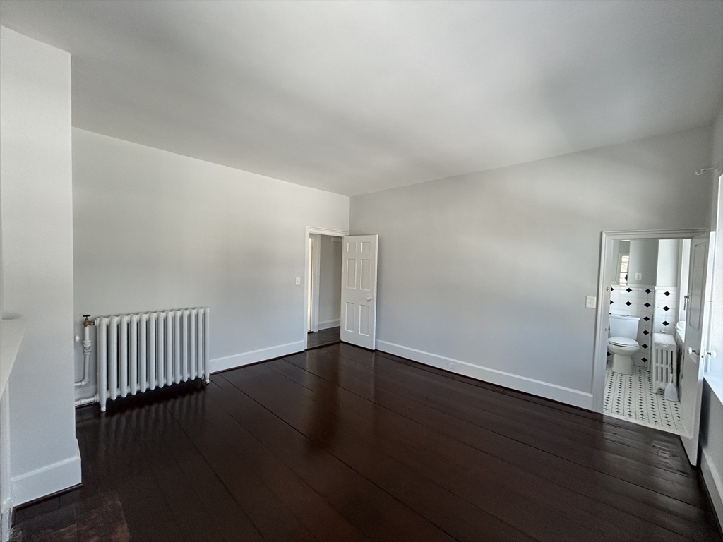 660 High Street Dedham, MA 02026 - Photo 21 of 25 a view of an empty room with wooden floor