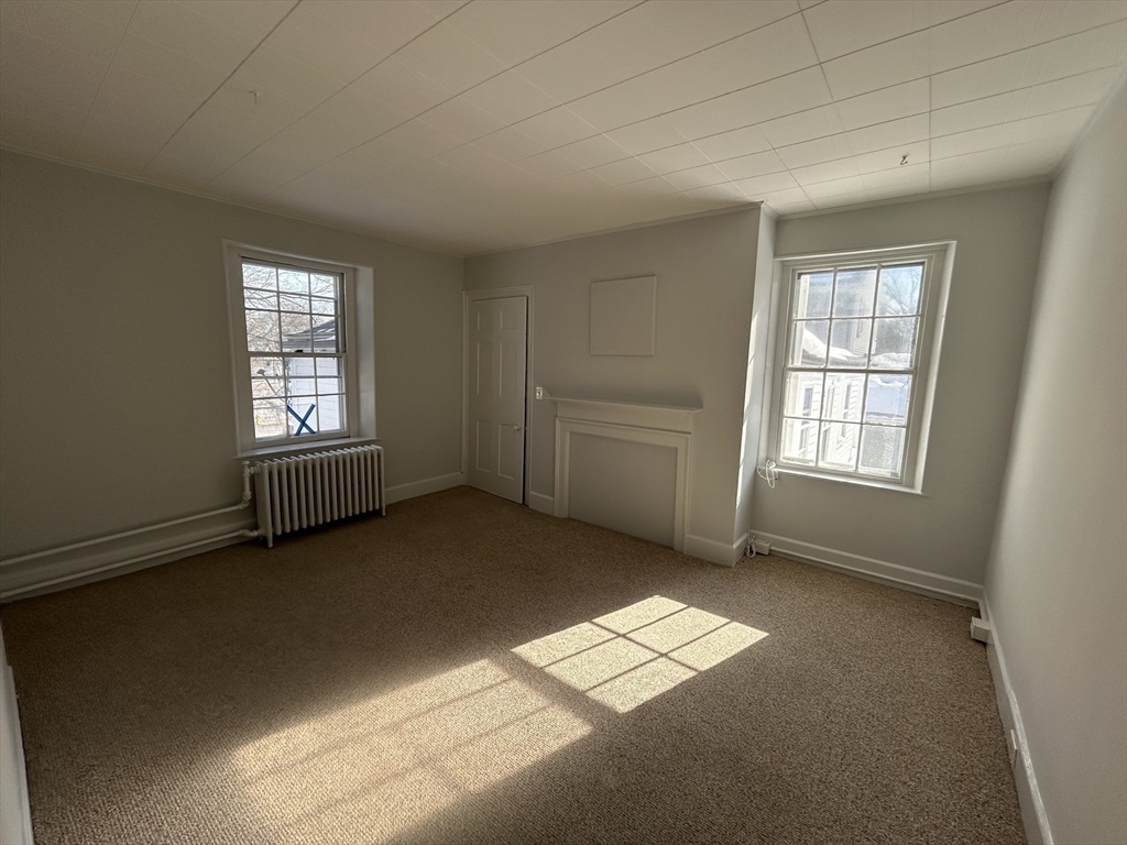 660 High Street Dedham, MA 02026 - Photo 23 of 25 an empty room with windows