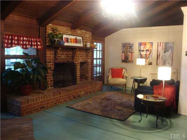 7120 Ebenezer Church Road Raleigh, NC 27612 - Photo 2 of 12 Open Great Room with living area, dining area & kitchen plus wood burning fireplace.