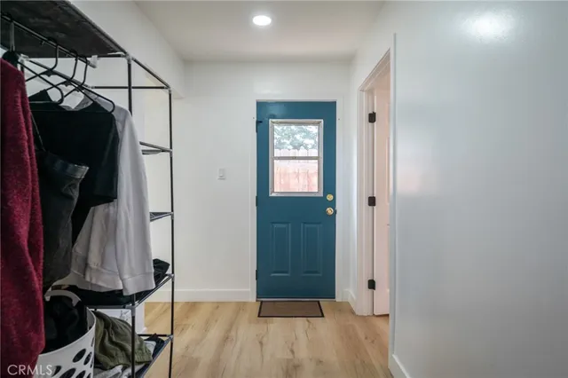 a view of hallway with wooden floor