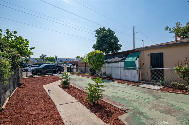 a view of a backyard with sitting area