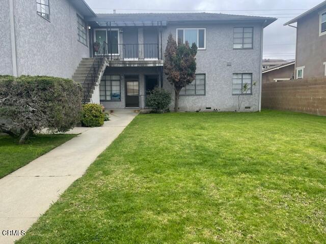 818 Palm Drive, Unit C Oxnard, CA 93030 - Photo 1 of 11 a front view of a house with a garden
