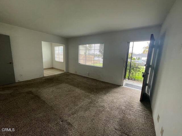 818 Palm Drive, Unit C Oxnard, CA 93030 - Photo 2 of 11 an empty room with windows
