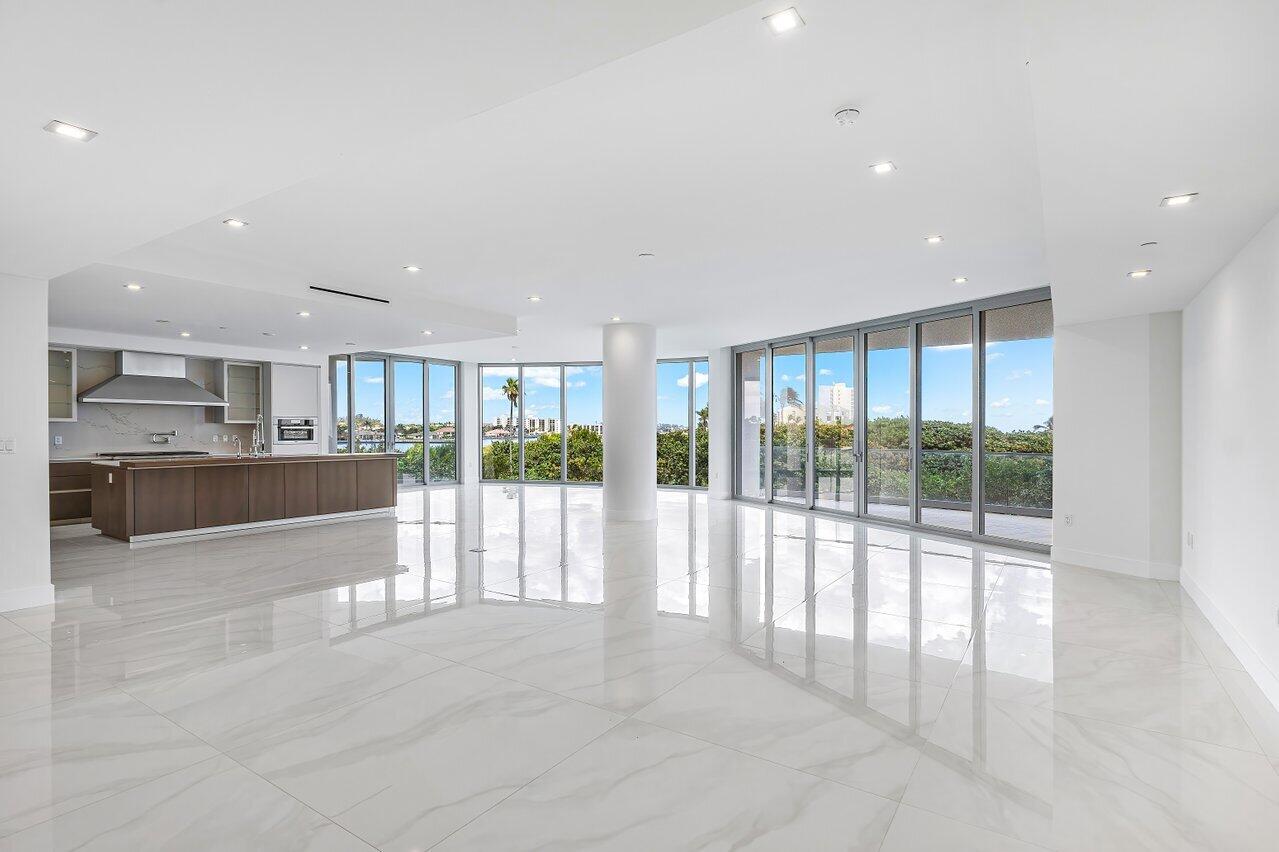 1500 South Beach Road, Unit 301 Tequesta, FL 33469 - Photo 17 of 21 a view of a kitchen with large windows