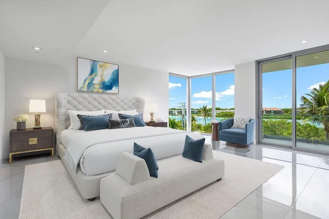 a bedroom with a bed and glass window