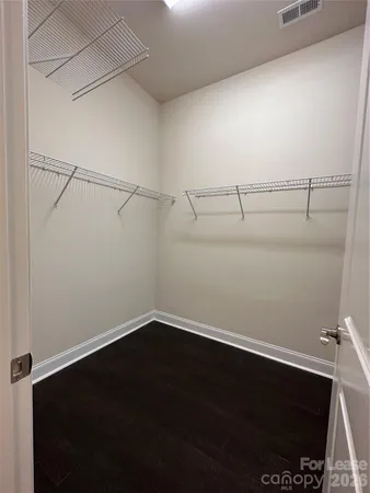 a view of a room with racks on the wall