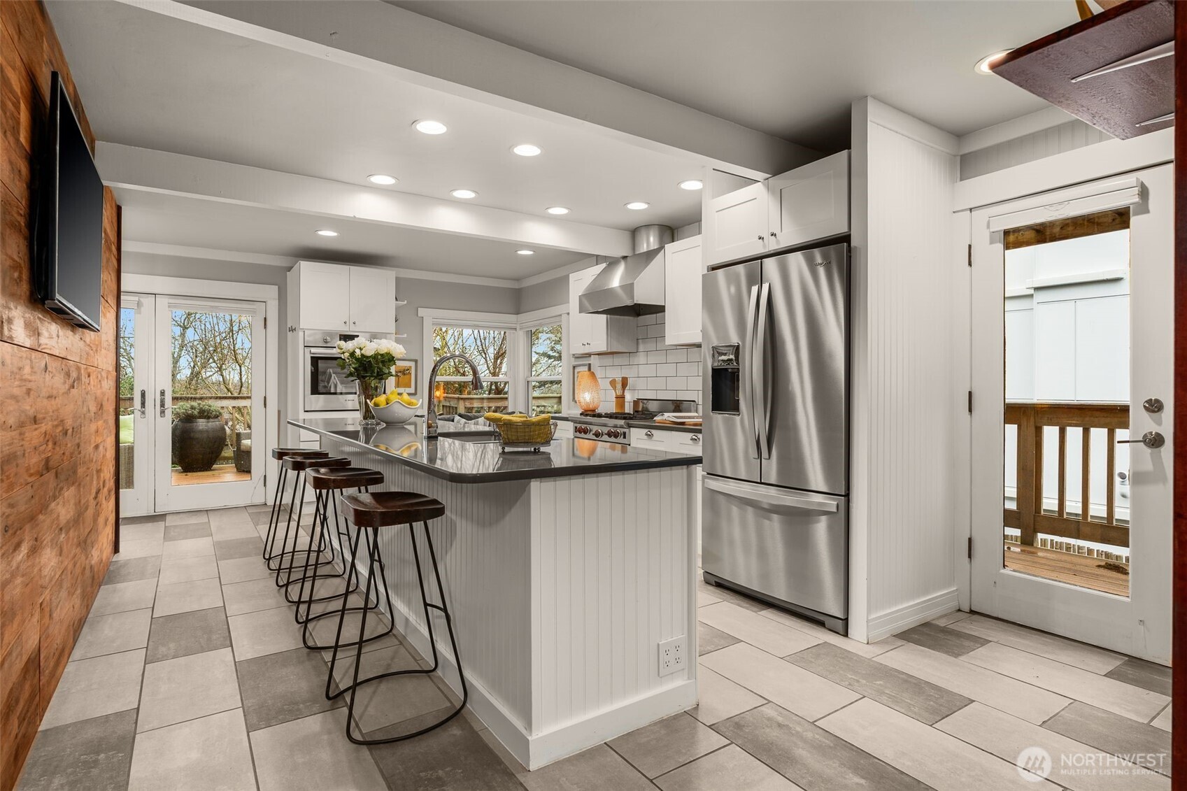 4123 Southwest Rose Street Seattle, WA 98136 - Photo 12 of 32 a kitchen with stainless steel appliances granite countertop a refrigerator and a sink