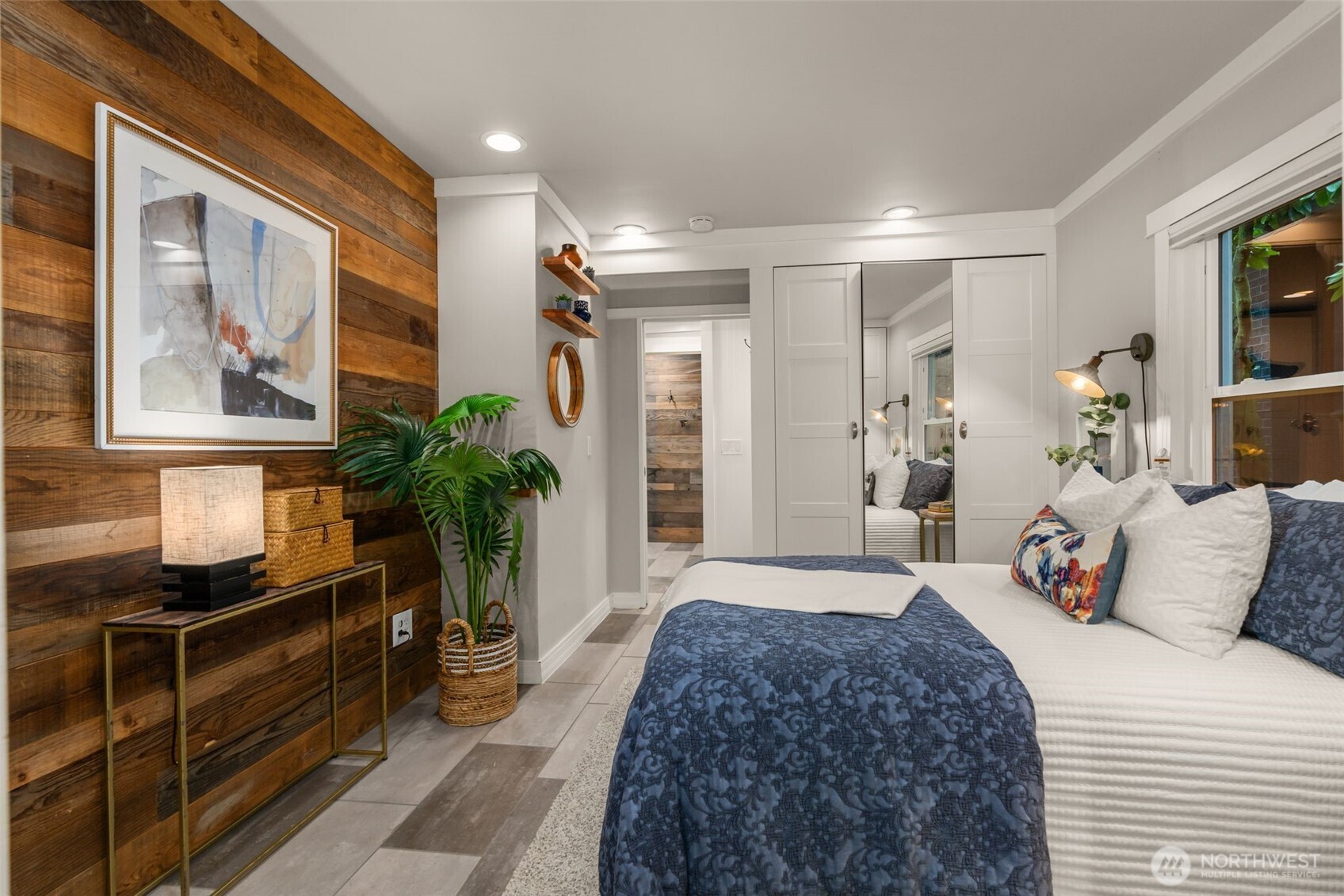 4123 Southwest Rose Street Seattle, WA 98136 - Photo 16 of 32 a bedroom with a bed and a potted plant