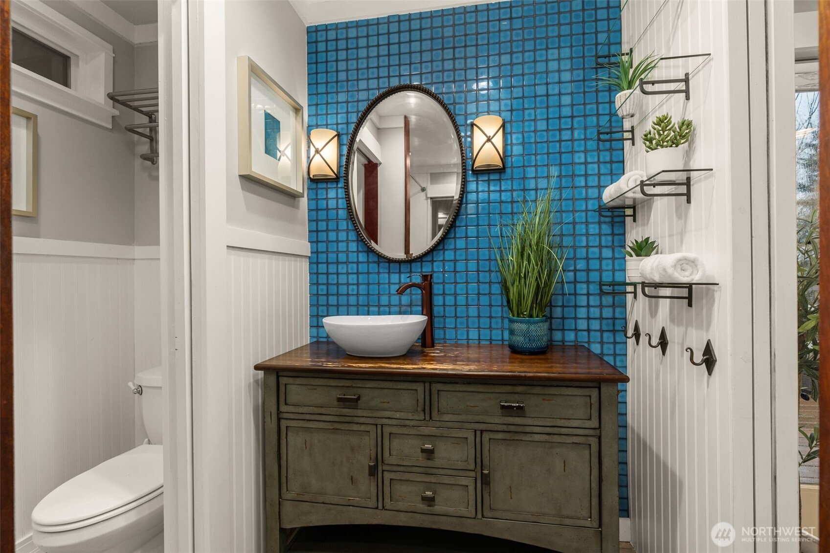 4123 Southwest Rose Street Seattle, WA 98136 - Photo 17 of 32 a bathroom with a toilet sink and mirror