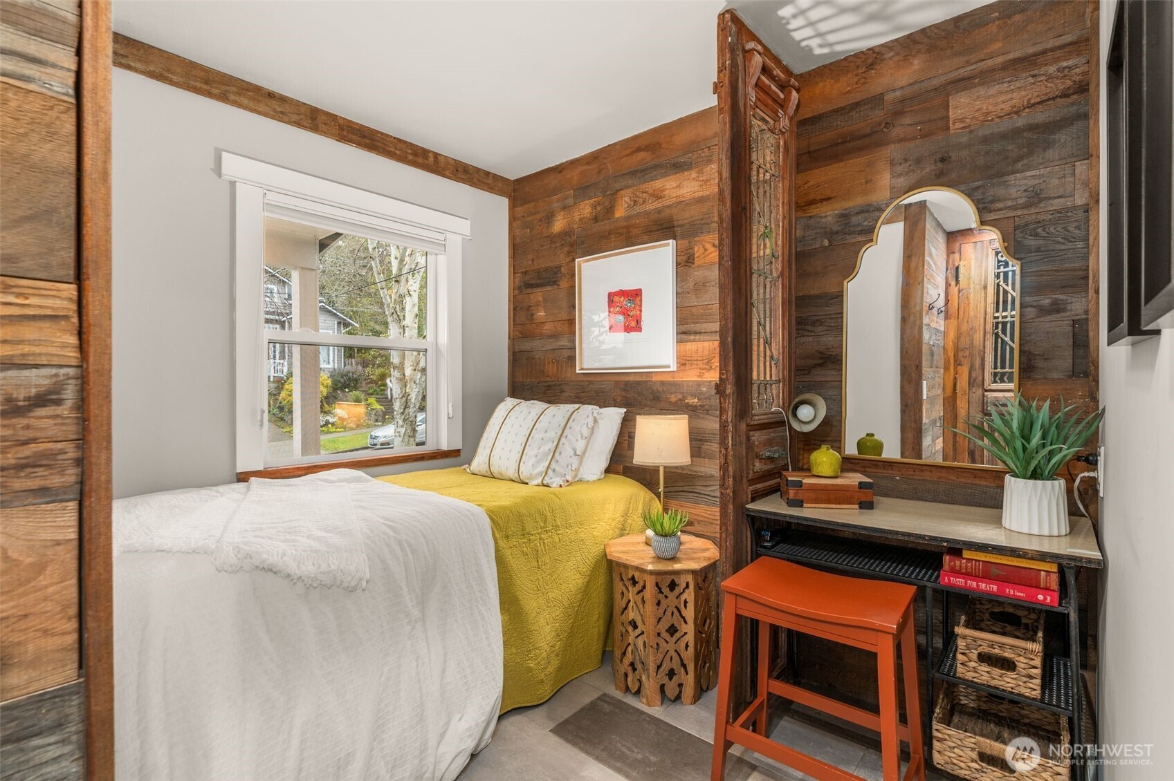 4123 Southwest Rose Street Seattle, WA 98136 - Photo 20 of 32 a bedroom with a bed and a dresser next to a window