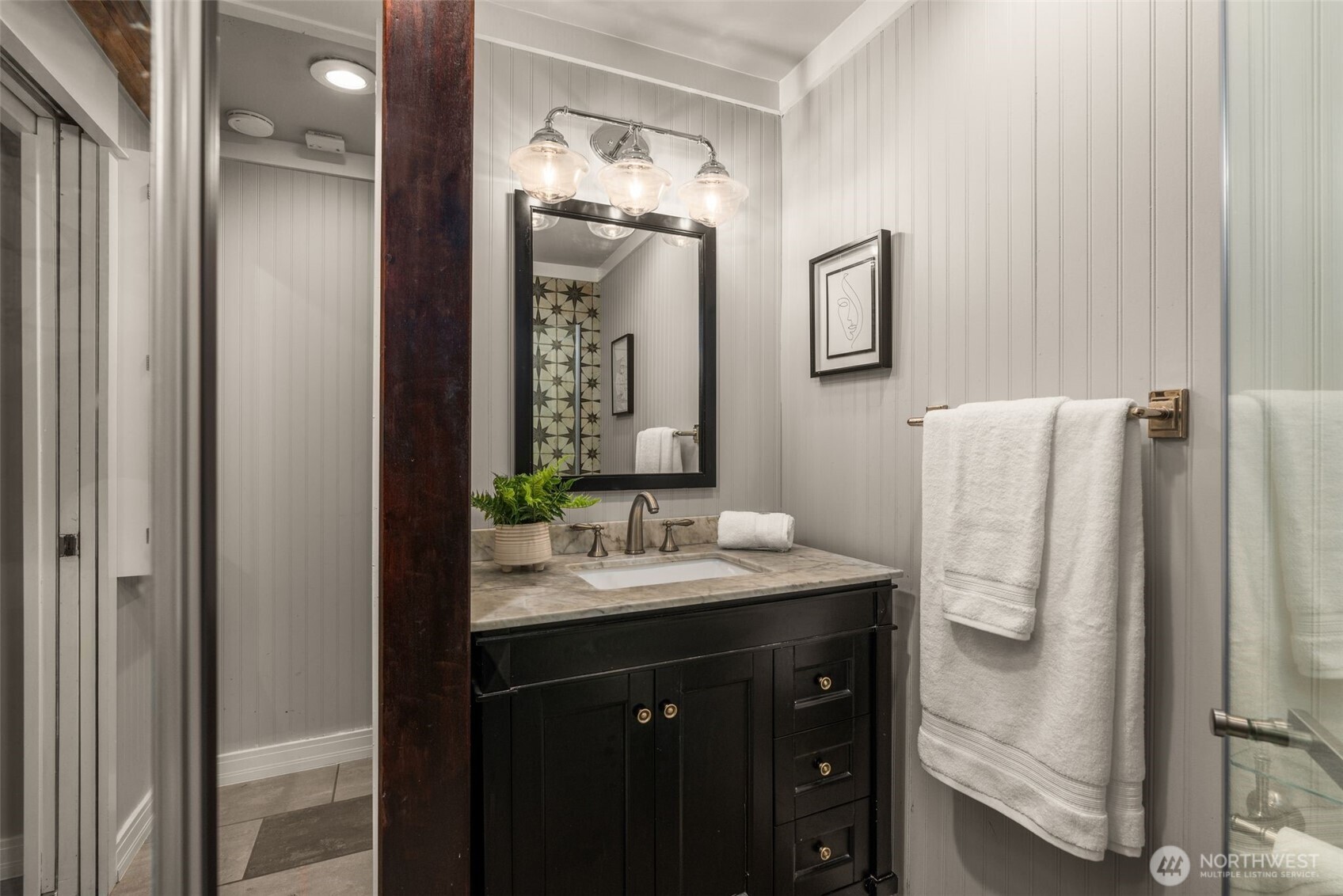 4123 Southwest Rose Street Seattle, WA 98136 - Photo 22 of 32 a bathroom with a sink and mirror