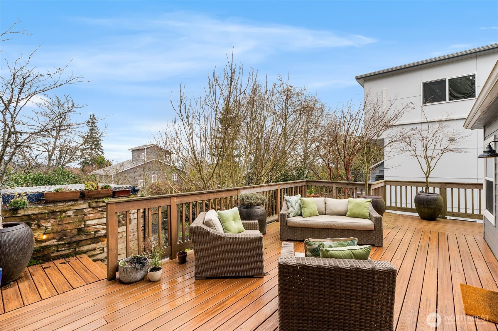 4123 Southwest Rose Street Seattle, WA 98136 - Photo 27 of 32 a balcony with wooden floor table and chairs