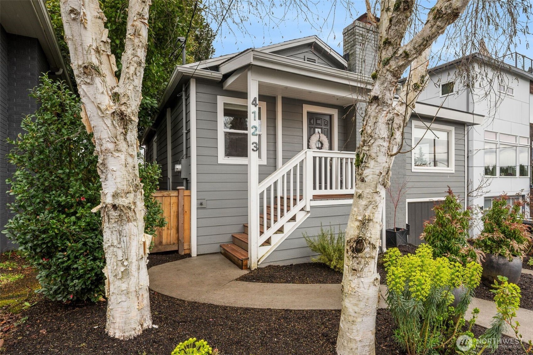 4123 Southwest Rose Street Seattle, WA 98136 - Photo 4 of 32 a view of a house with a yard