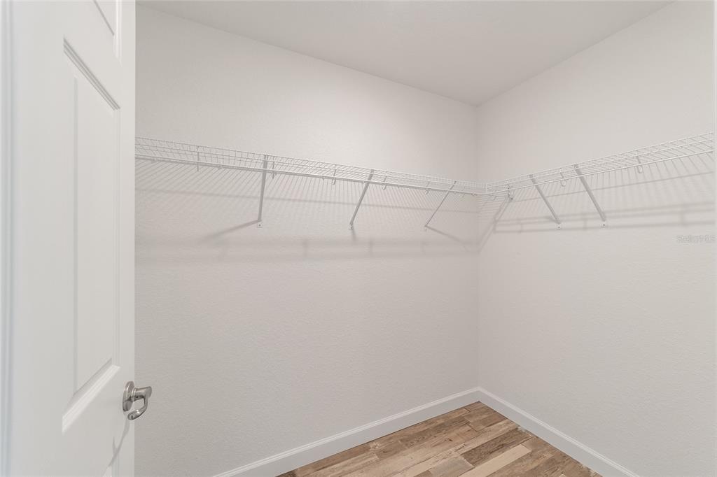 3103 Southwest 130th Lane Ocala, FL 34473 - Photo 22 of 31 a view of a room with racks on the wall