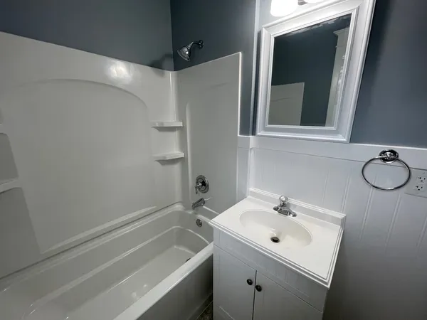 a bathroom with a sink and a bathtub