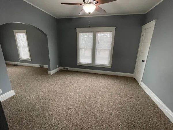 an empty room with a empty space and a window