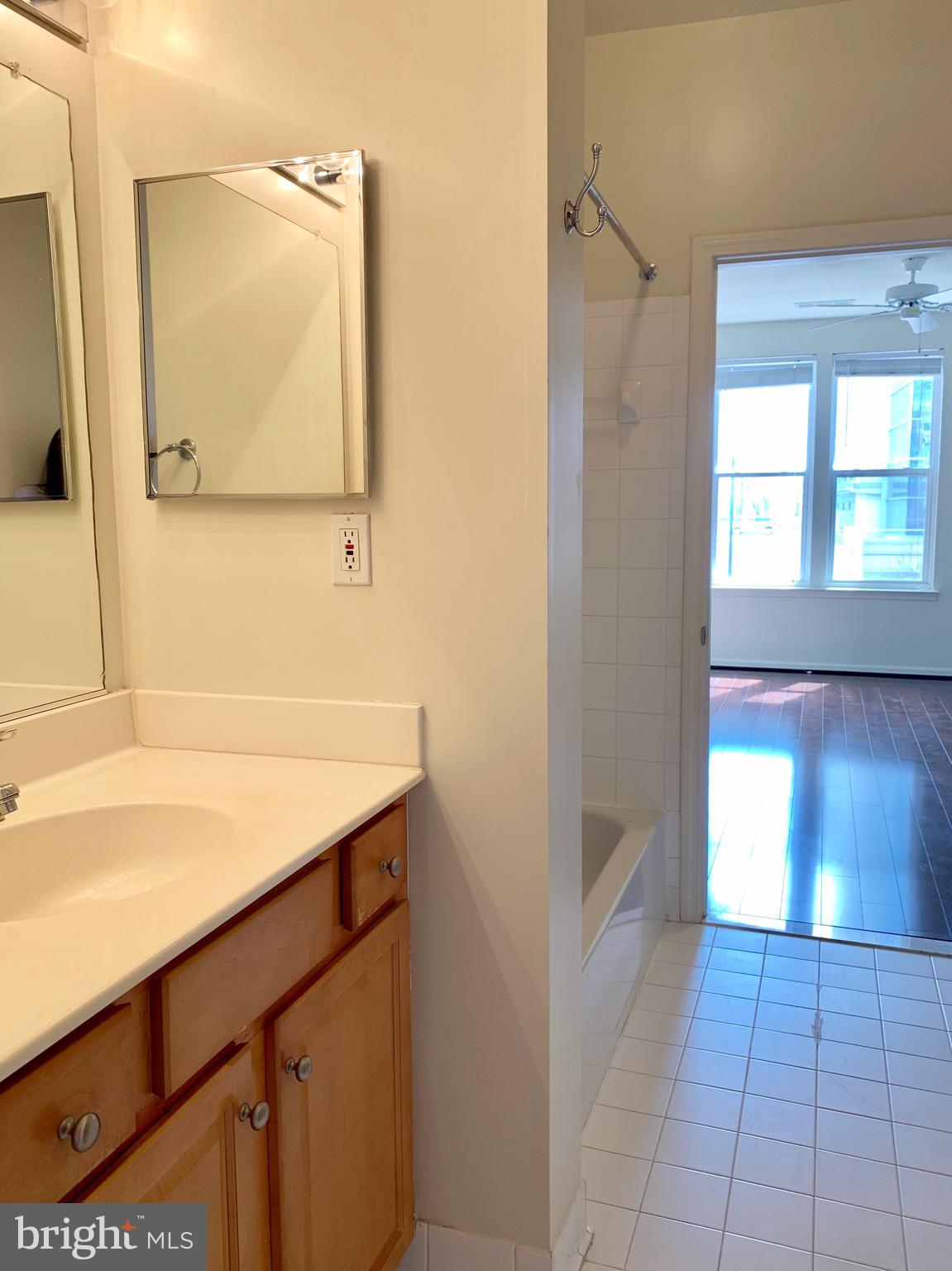 12001 Market Street, Unit 261 Reston, VA 20190 - Photo 14 of 24 full bath with medicine cabinet