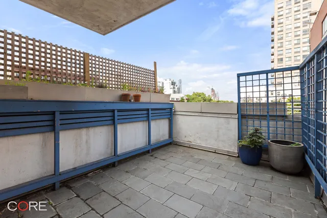 a view of a terrace with chair and potted plants