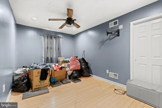 a bathroom with a sink toilet and a mirror