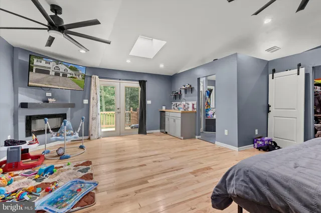 a bathroom with a sink vanity and a mirror