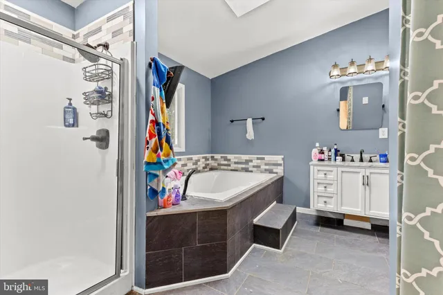 a bathroom with a sink a vanity and mirror