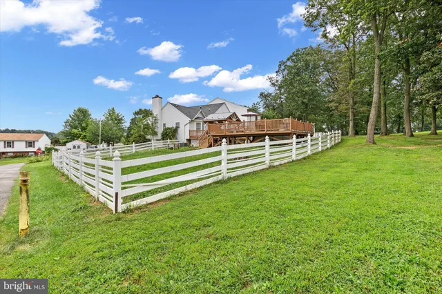 a view of a house with a backyard porch and sitting area