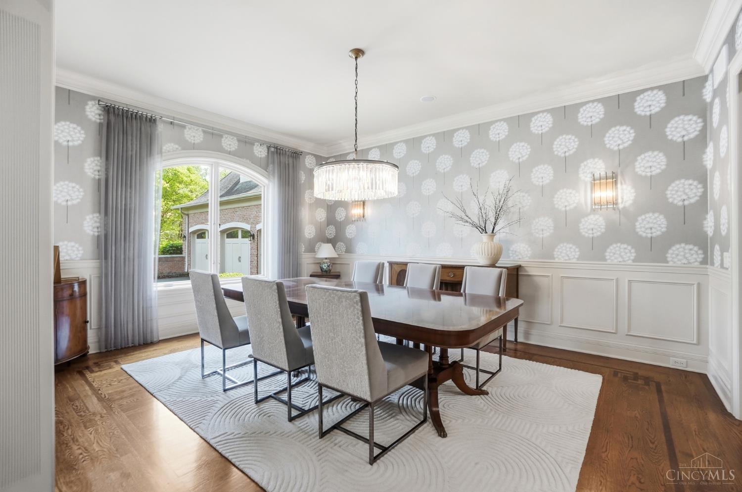 4535 Drake Road Cincinnati, OH 45243 - Photo 28 of 96 This gorgeous dining room boasts a chandelier, wainscoting and hardwood floors.