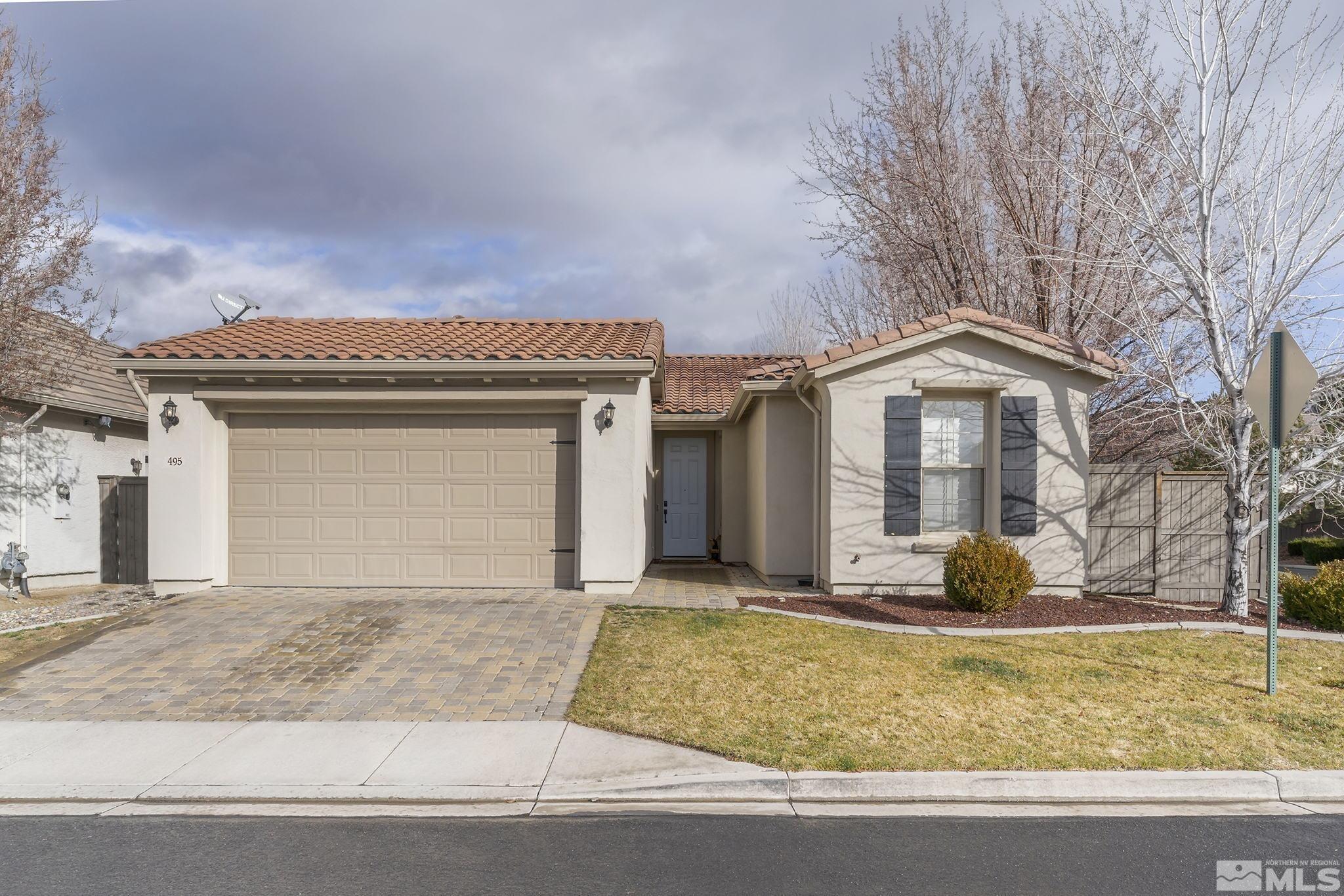 495 Dartmoor Court Reno, NV 89521 - Photo 1 of 22 a front view of a house with garden