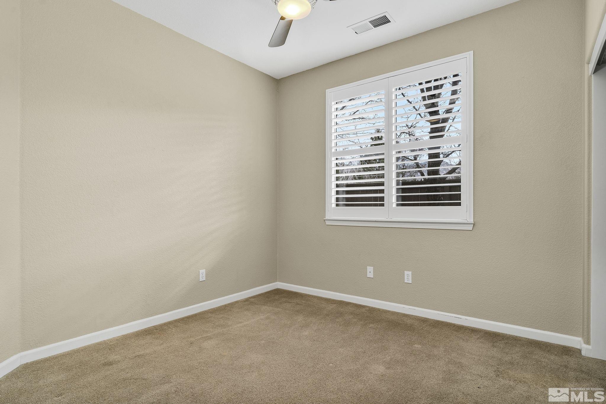 495 Dartmoor Court Reno, NV 89521 - Photo 16 of 22 an empty room with a window