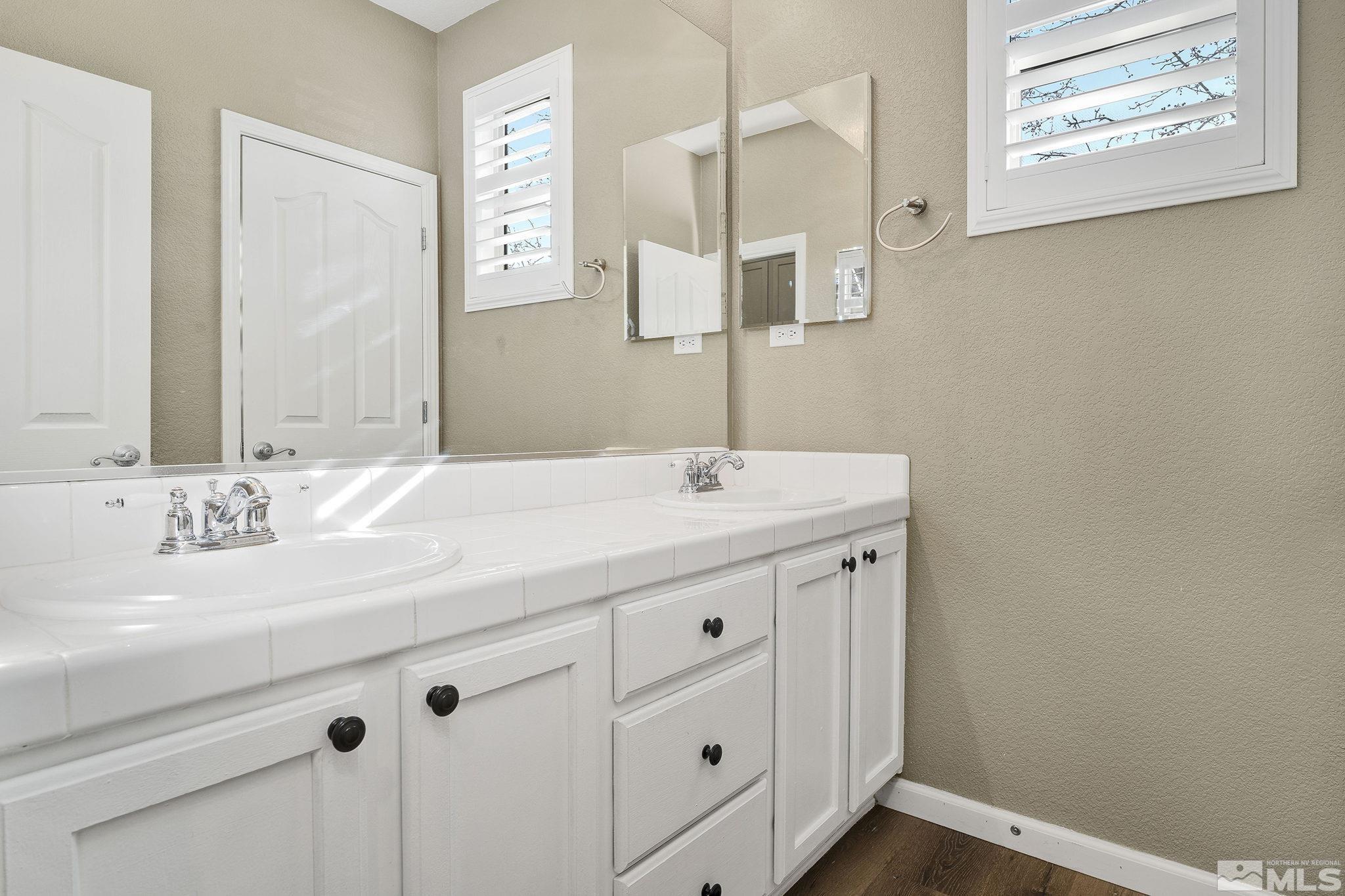 495 Dartmoor Court Reno, NV 89521 - Photo 17 of 22 a bathroom with a sink and a mirror