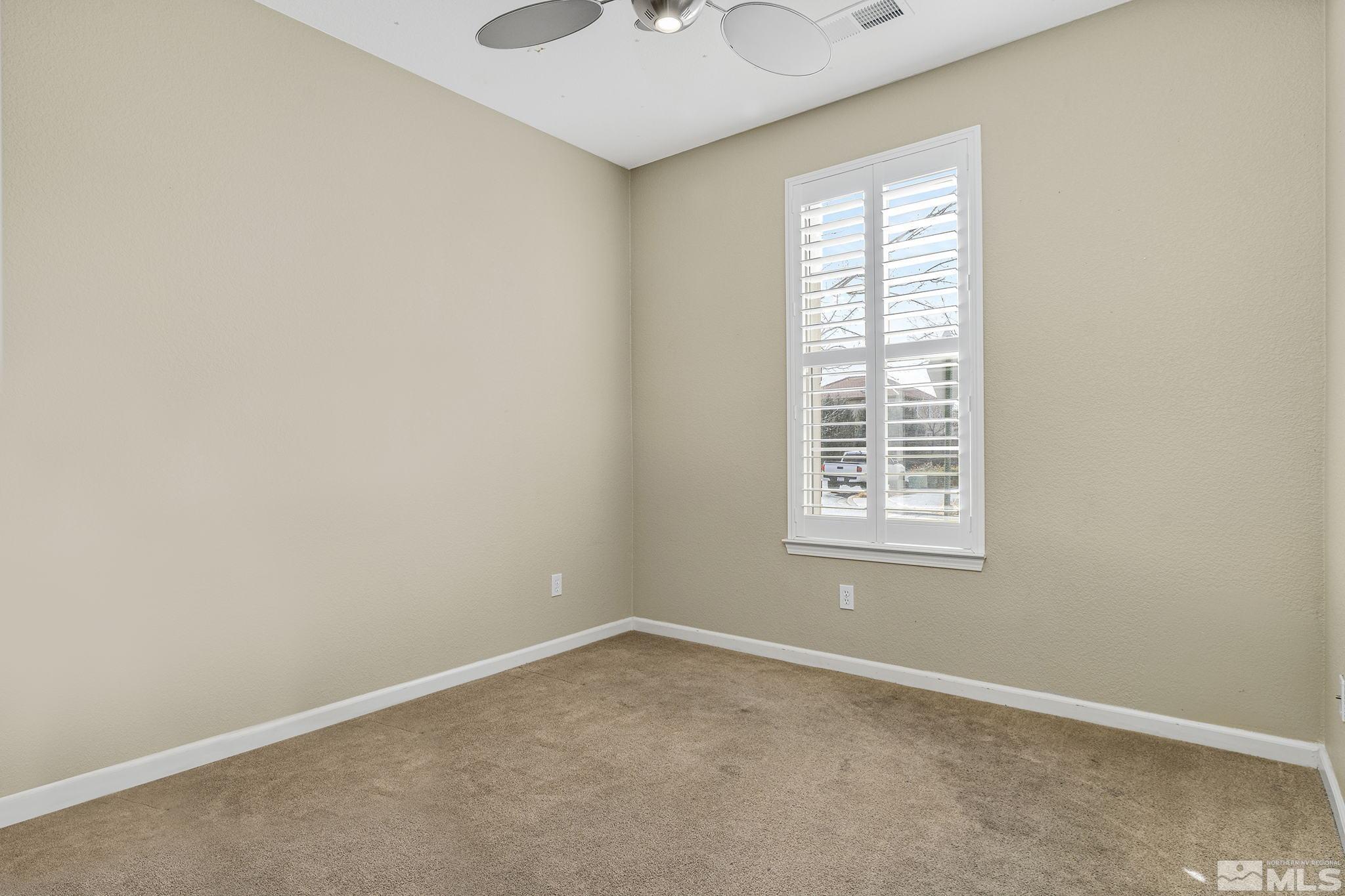 495 Dartmoor Court Reno, NV 89521 - Photo 18 of 22 an empty room with a window