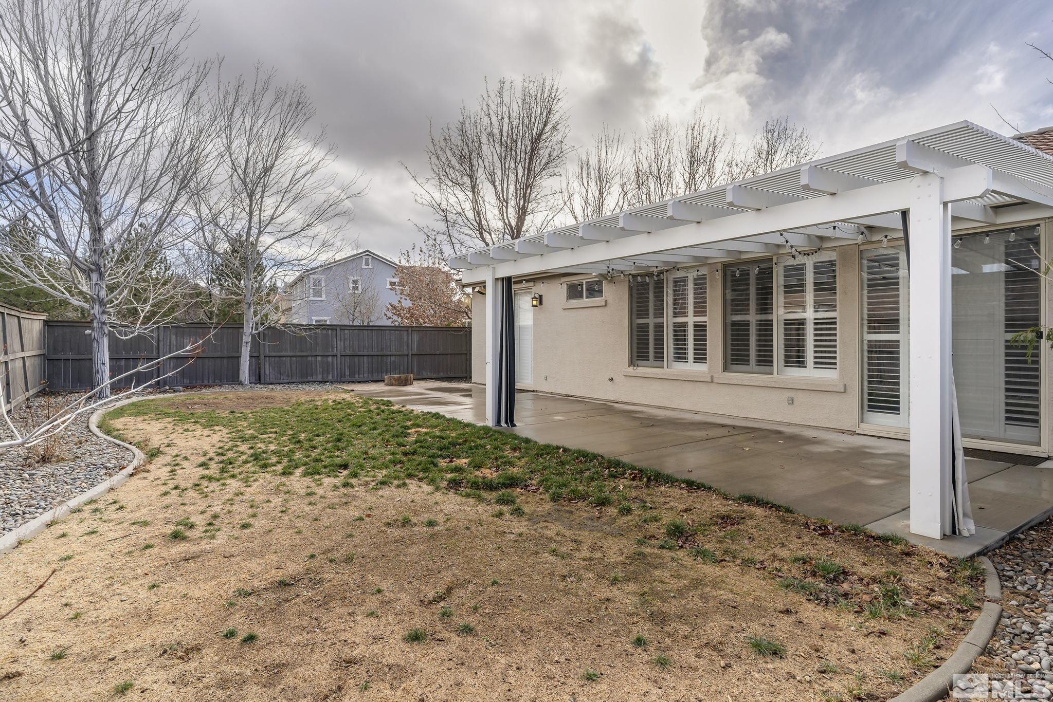 495 Dartmoor Court Reno, NV 89521 - Photo 20 of 22 a house with trees in the background
