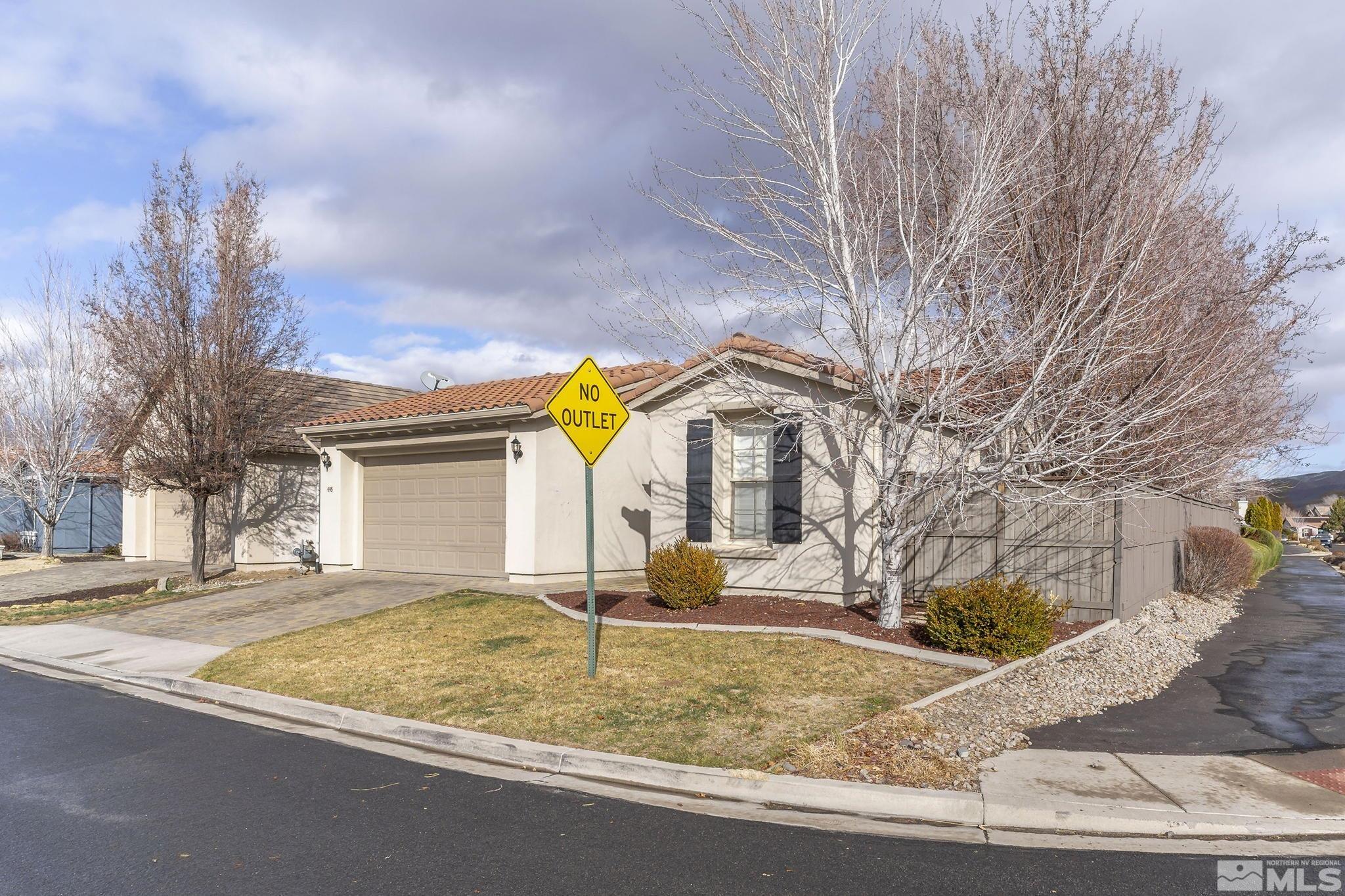 495 Dartmoor Court Reno, NV 89521 - Photo 2 of 22 a view of a house with snow on the road