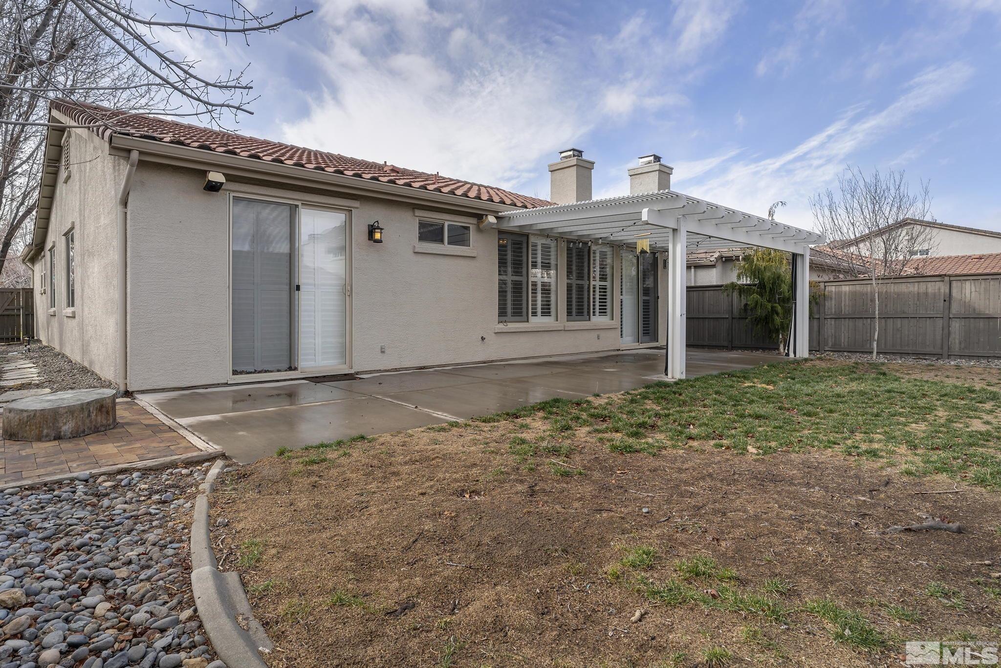 495 Dartmoor Court Reno, NV 89521 - Photo 21 of 22 a view of a house with a yard